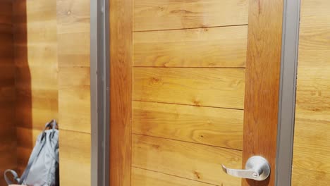 woman trying on clothes in dressing room mirror