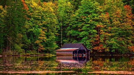 timelapse of moving water on a tidal lake with autumn colored forest in the backdrop