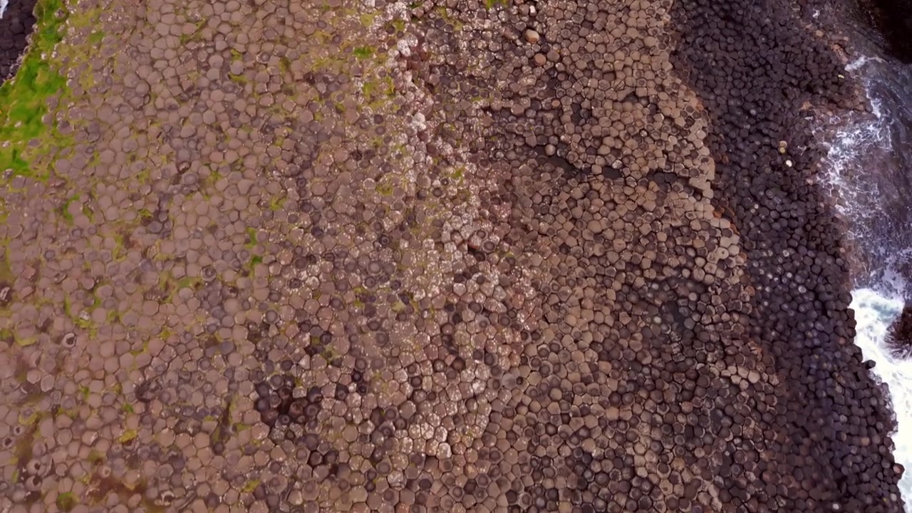 Overhead 4K 60FPS aerial video of The Giant's Causeway in Bushmills, County Antrim in Northern Ireland, UK. Produced in 3840x2160 and with Rec709 color.