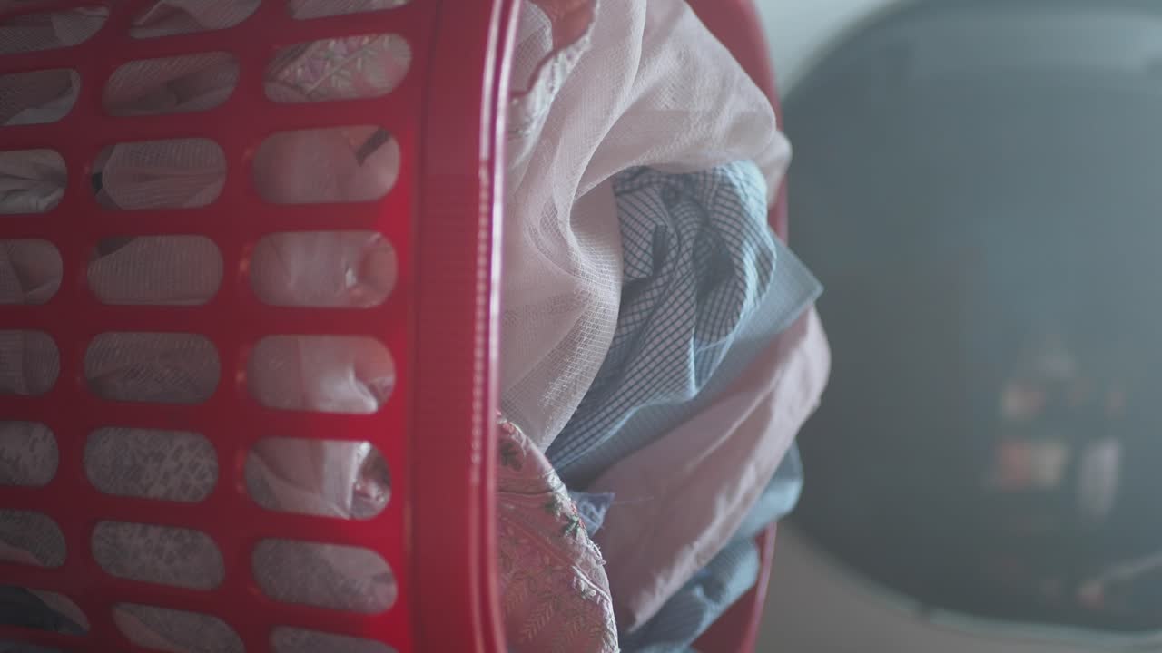 Red Laundry Basket Filled with Clothes