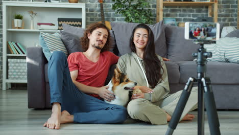 couple vlogging with their dog at home