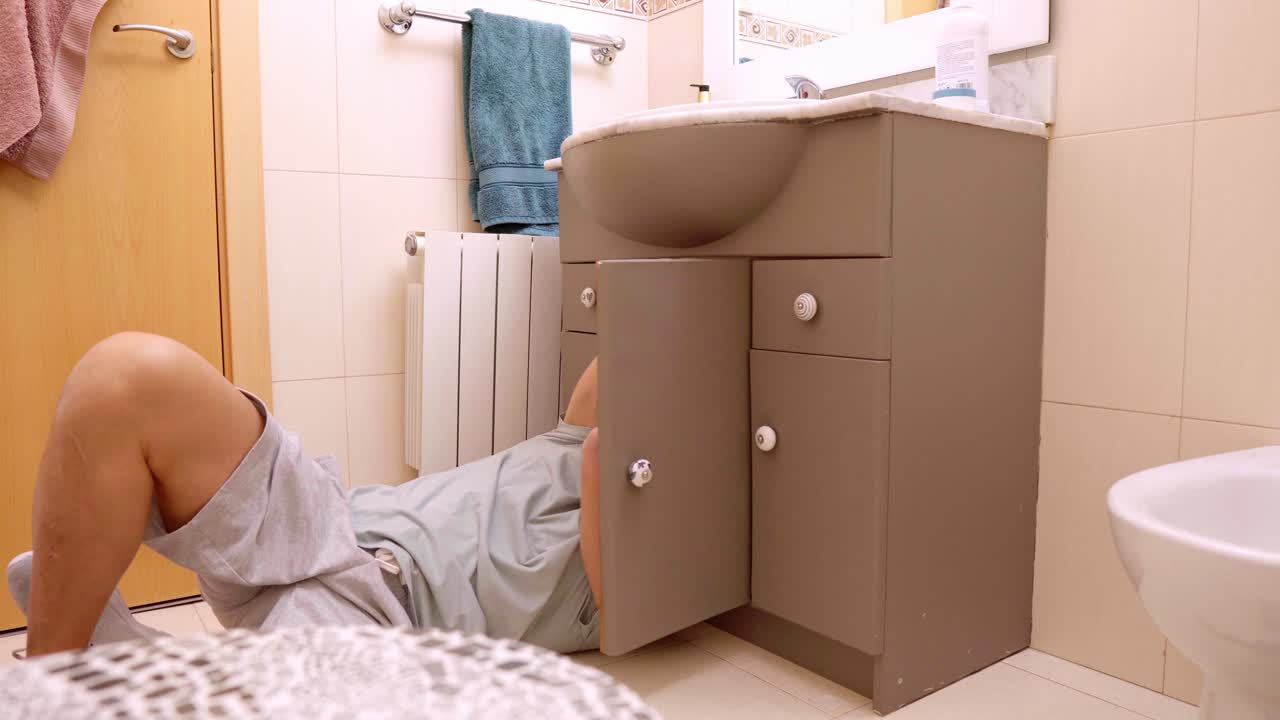 Man trying to fix sink problem calls technician