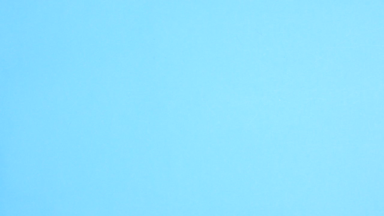 Back to school pastel accessories appear on left and right side of pastel blue theme with empty space for text. Stop motion