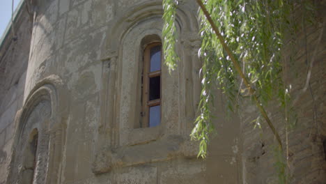 A-12th-century-Georgian-Orthodox-church-window-view-in-the-Lurji-Monastery,-or-"Blue-Church",-in-Tbilisi-Georgia
