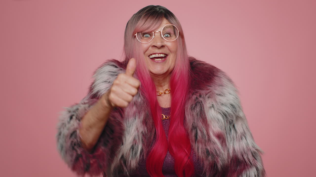 Woman pointing down, saying to subscribe, gesturing ok and like, showing place for commercial info