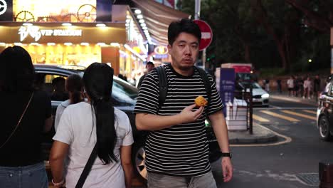 people walking and interacting on busy street