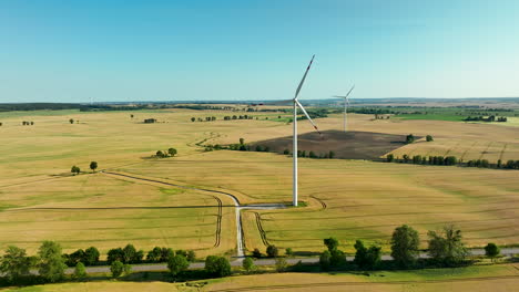 aerial view of wind turbines in a rural field