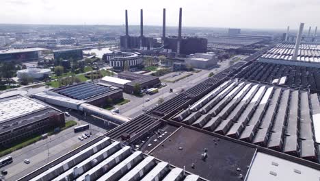 wolfsburg volkswagen factory with headquarters building of vw in background