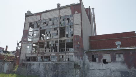 large, ruined building with broken windows