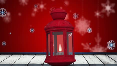 Animation-Von-Schneeflocken,-Die-über-Die-Rote-Weihnachtslaterne-Fallen