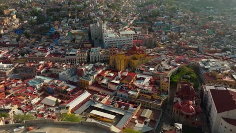 drone shot: doly in el pipila statue and guanajuato city in mexico