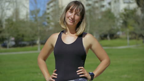 smiling young woman with piercing looking at camera.