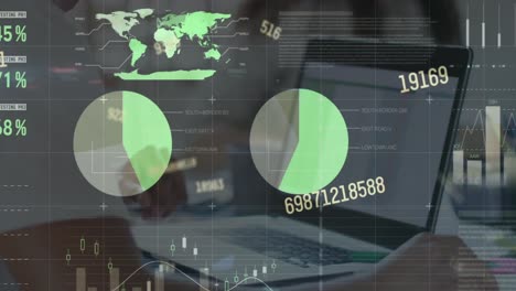 animation of statistical data processing against mid section of a man using laptop at office