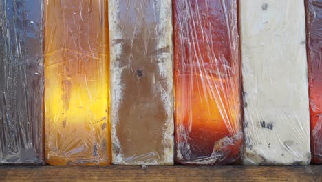 variety of handmade soap bars in a wooden box