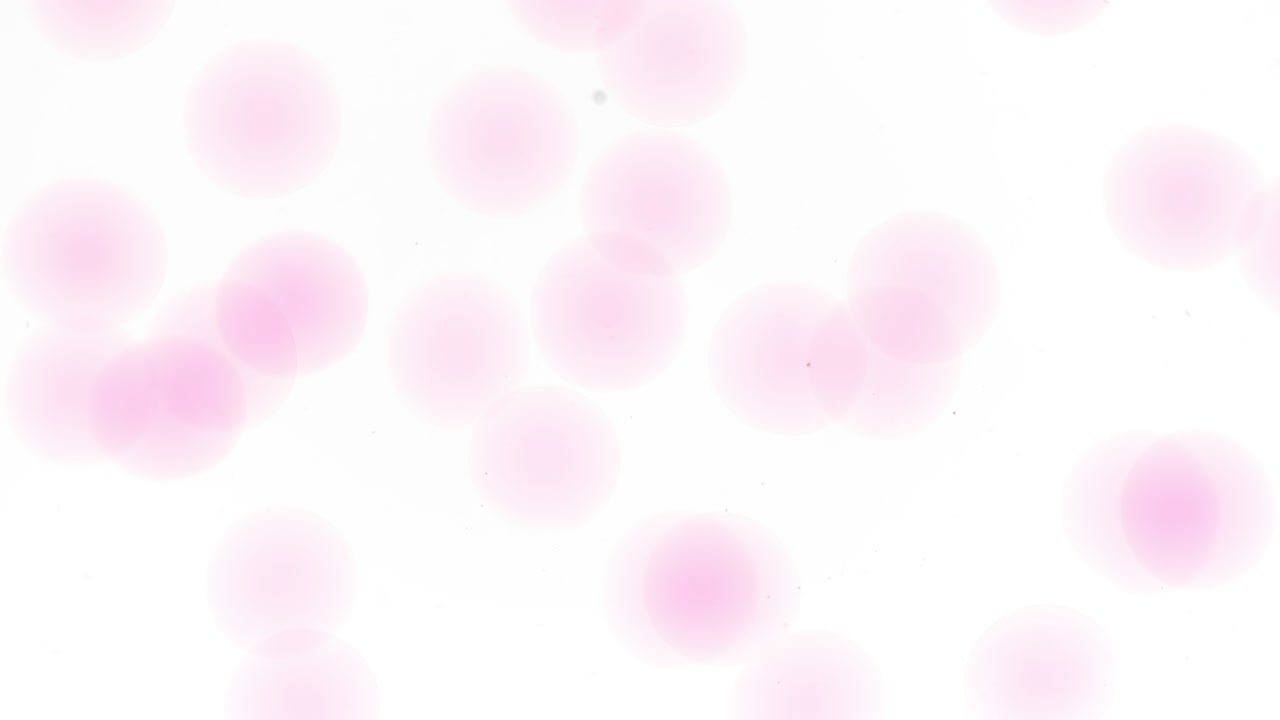 Tiny grey bubbles of hyaluronic acid are moving spontaneously