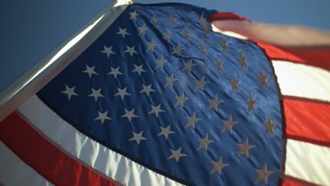 Closeup-of-American-flag-blowing-in-wind-in-slow-motion