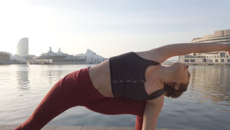 girl-doing-stretching-exercises-in-the-port