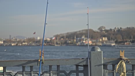 fishermen fishing on the bosphorus, galata bridge, with a sea view