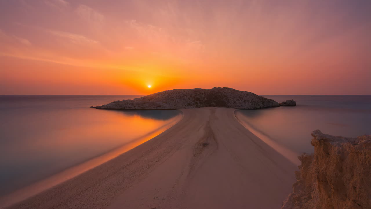 Stunning Sunset over a Sandy Path Leading to an Island