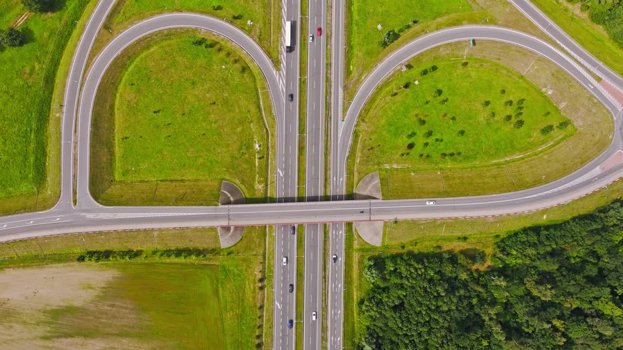Cinematic ascending drone view of highway bridge, traffic roads, Paslek Poland