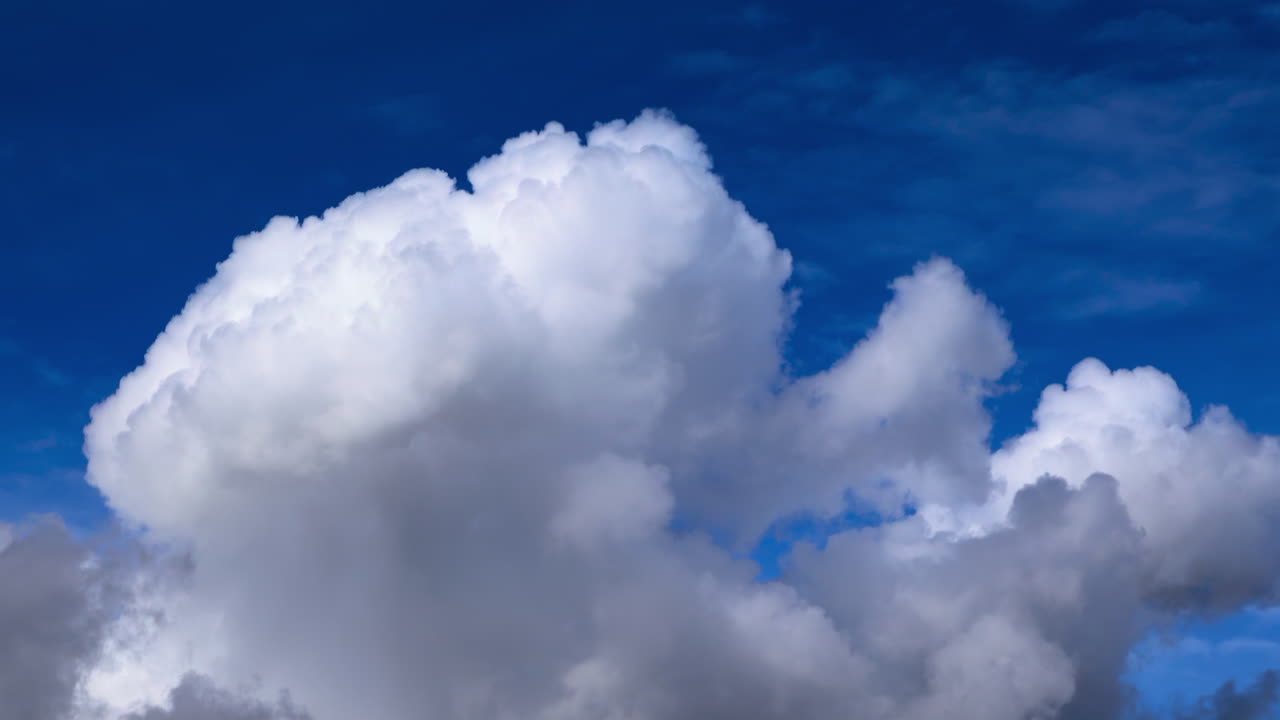 View of white clouds, fluffy moving on the blue sky