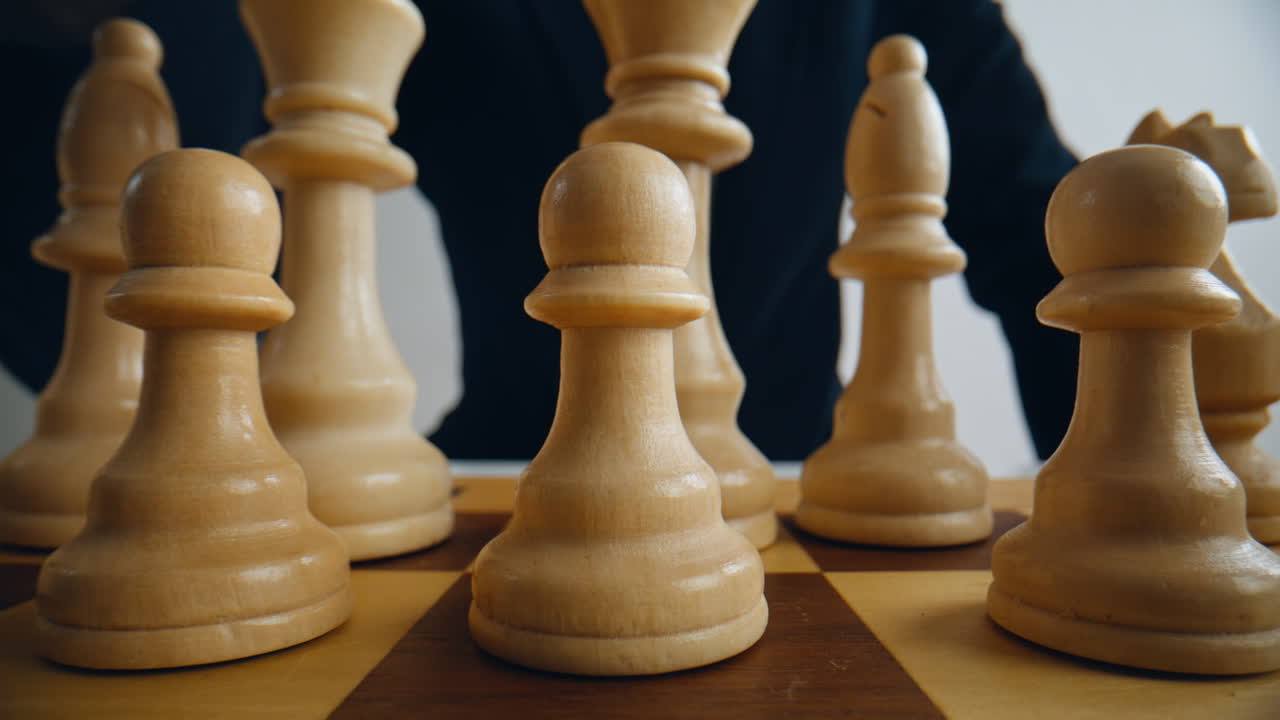 Gamer fingers shifting chess on competition grid closeup. Logic match challenge