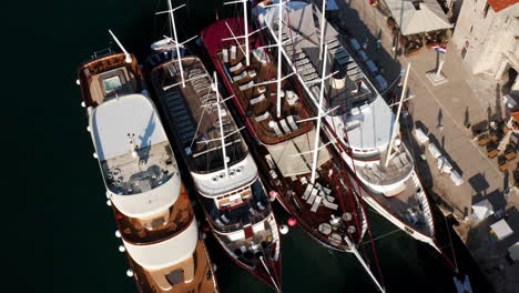 traditional wooden ships moored at marina in trogir, croatia