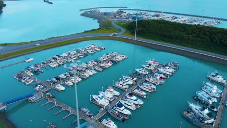 4k drone video of commercial fishing vessels in valdez boat harbor in valdez, alaska during sunny summer day