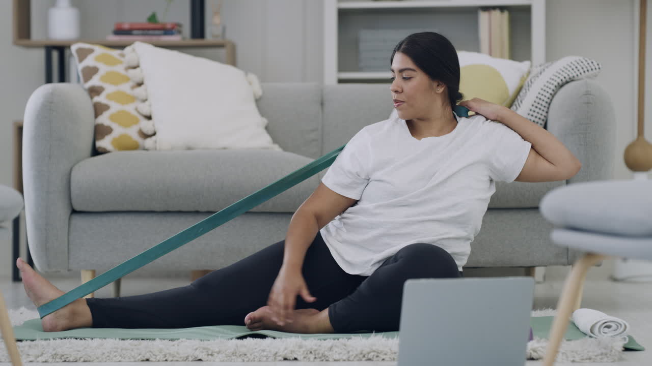 Plus size woman exercising in an online class