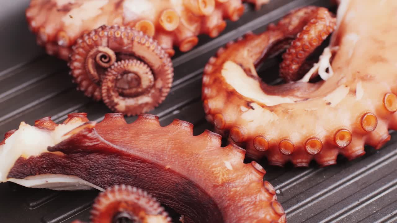 Octopus cooking, chef grill fresh octopus galician style on restaurant kitchen, healthy food, seafood cafe in spain, traditional asian japanese spanish and mediterranean dish.