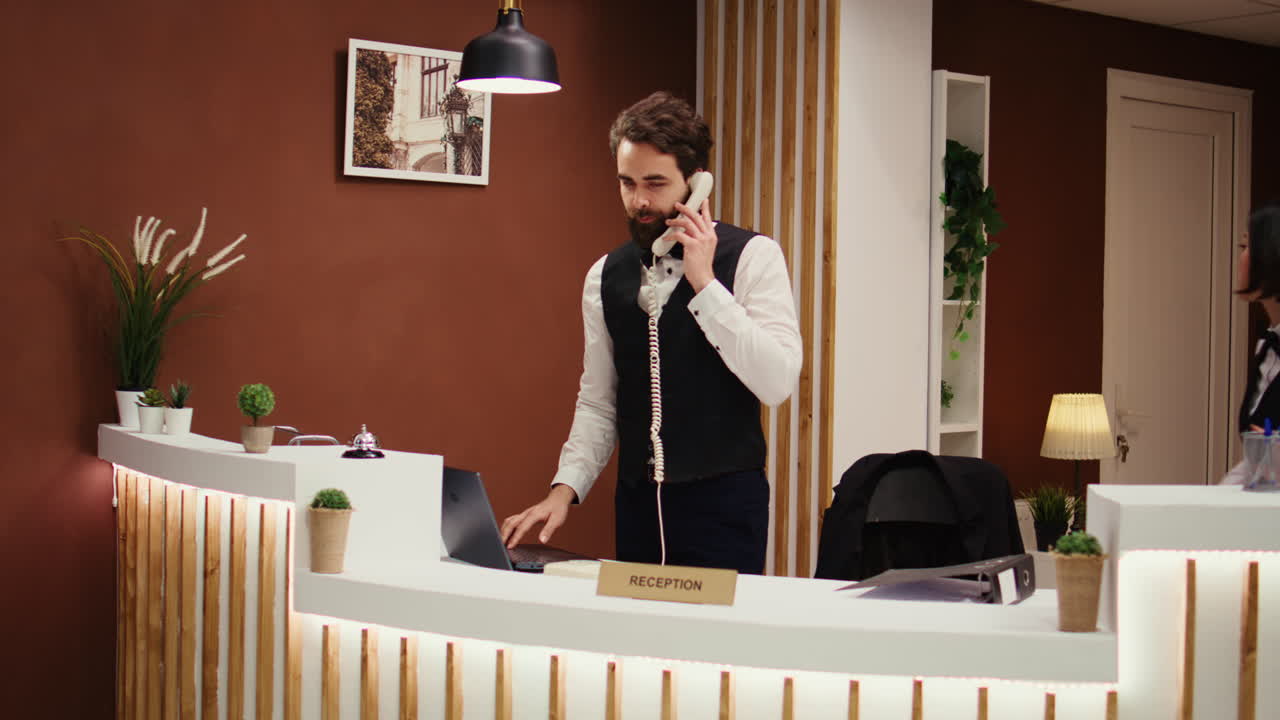 Hotel manager taking guest feedback