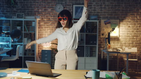 Woman Dancing in the Office at Night
