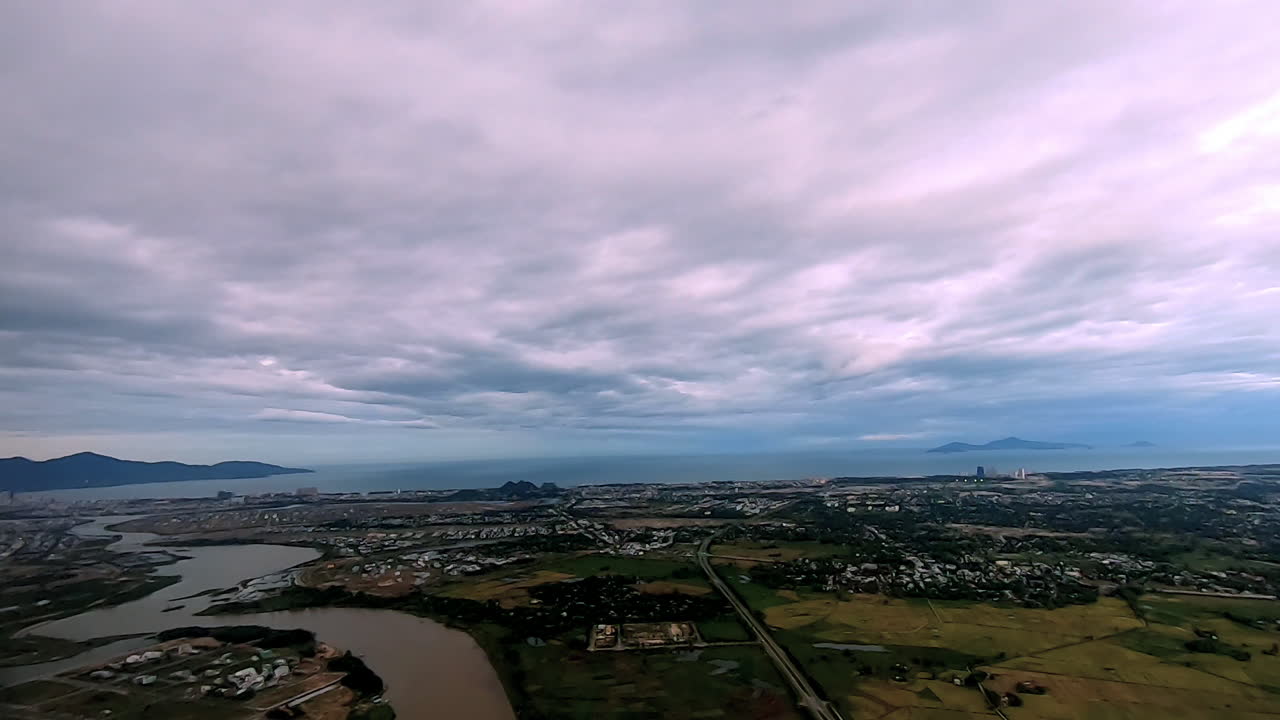 Looking at the clouds and Da Nang city in the airplane in Asia.