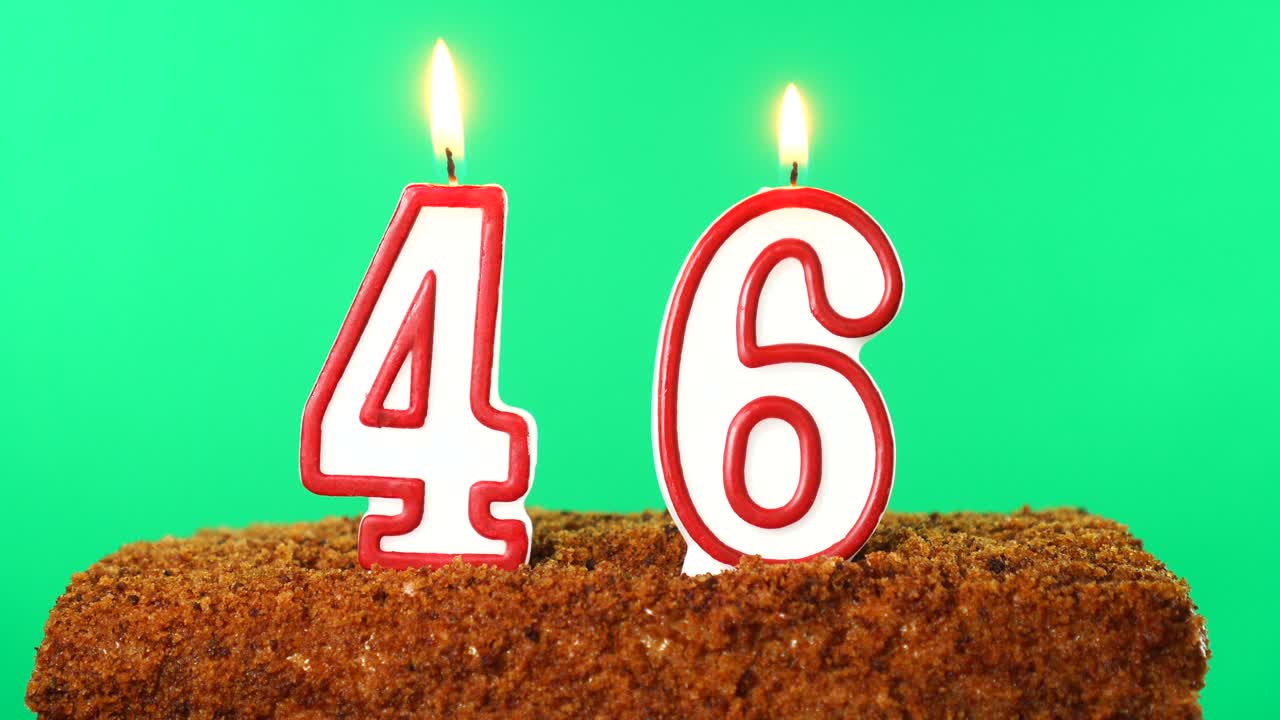 Cake with the number 46 lighted candle. Chroma key. Green Screen. Isolated