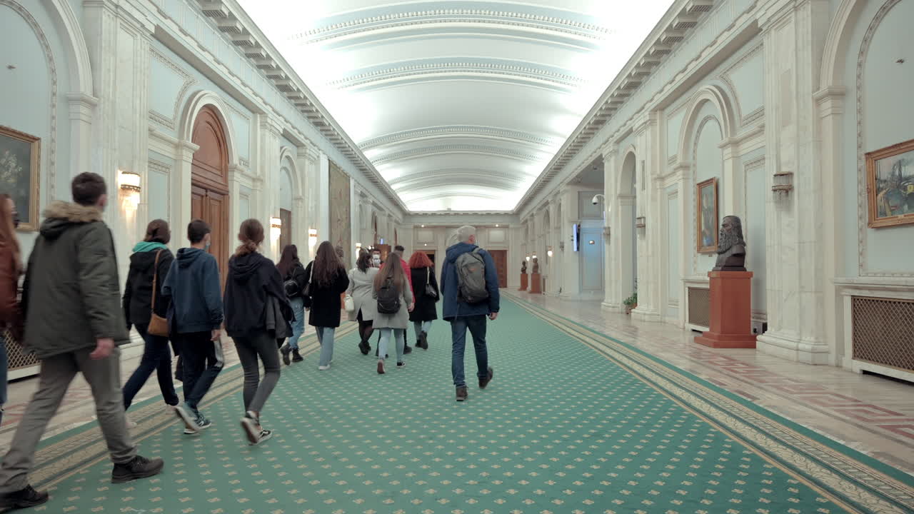 Bucharest, Romania - December 17, 2021: People walking on the inside of the Palace of Parliament