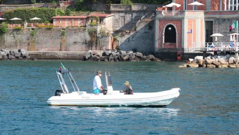 two people on a boat in naples, italy