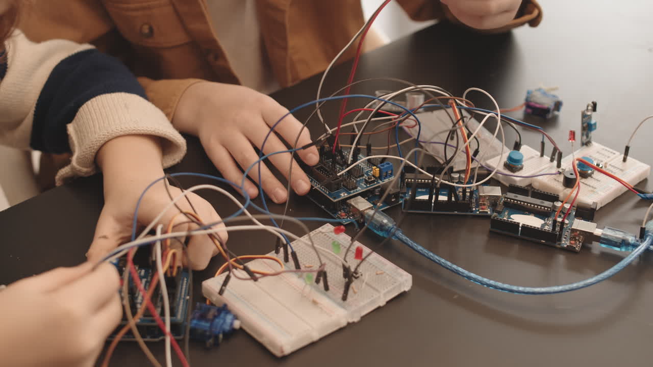Children Learning Electronics and Circuitry with Arduino and Breadboards