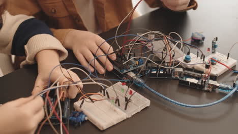 children learning electronics and circuitry with arduino and breadboards
