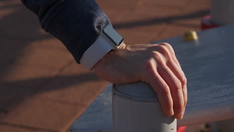 man exercising outdoors with smartwatch