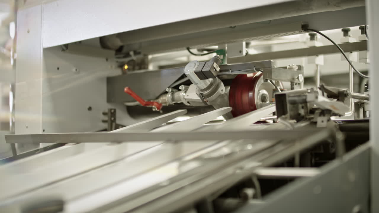 Produstion line in printing house, paper traveling on the production line
