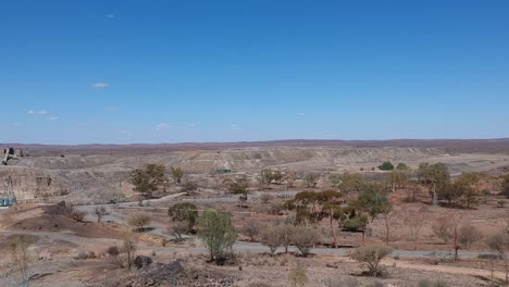 drone flying over broken hill