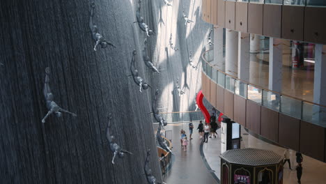 dubai mall interior with waterfall and sculptures