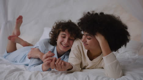 happy couple laying on bed