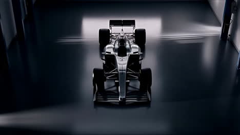 sleek formula 1 race car in a dark garage