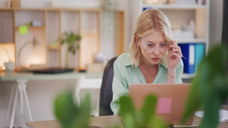 Pensive-Woman-Working-on-Laptop