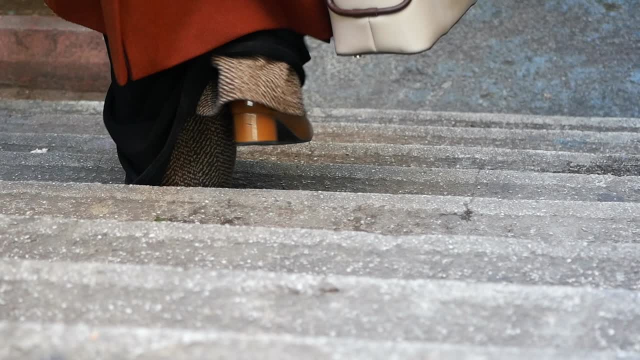 Woman Walking Up Stairs