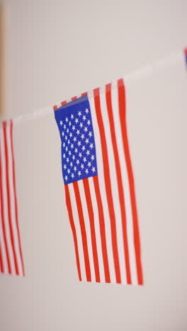 vertical video close up of american stars and stripes flag bunting for party celebrating 4th july independence day 1