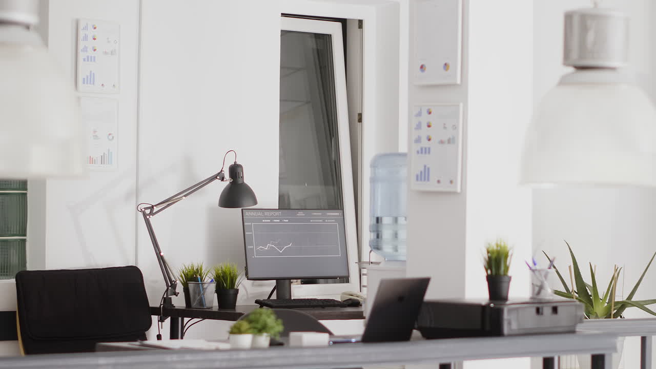 An office setting with a desk and computer