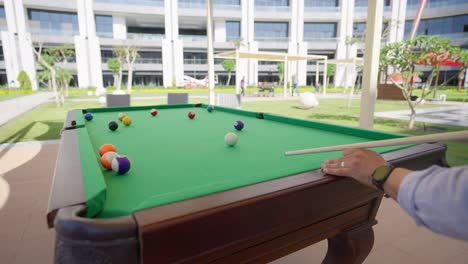 billiard competition between young men in the hall insert shot, wide shot