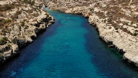 Flyover-Crystal-Clear-Blue-Ocean-Bay